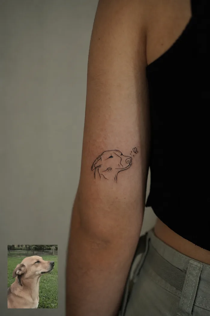 Fine Line Tattoo eines Hundes mit Schmetterling
