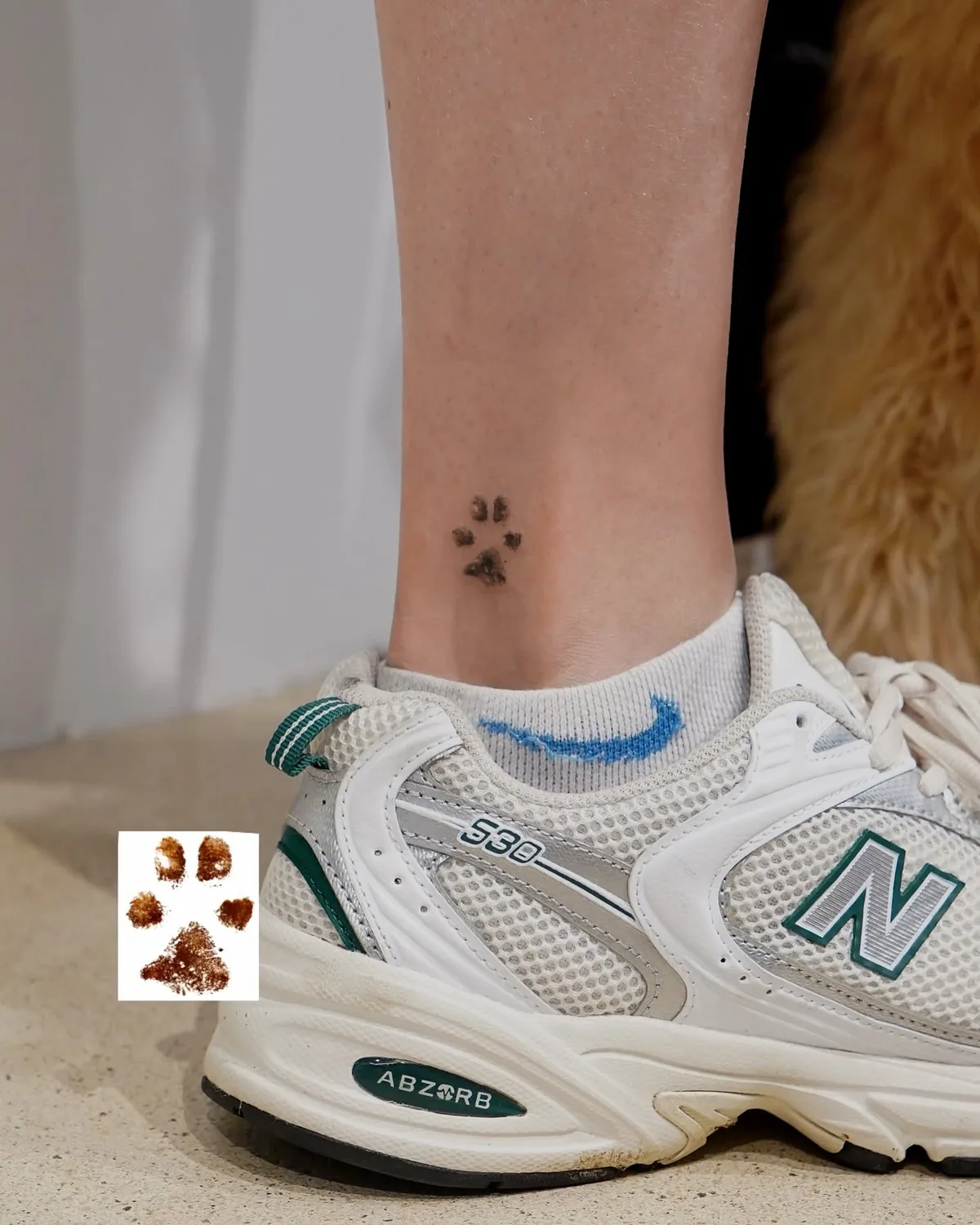 Paw print tattoo on ankle, direct imprint of a dog's paw, 3 cm, Zürich
