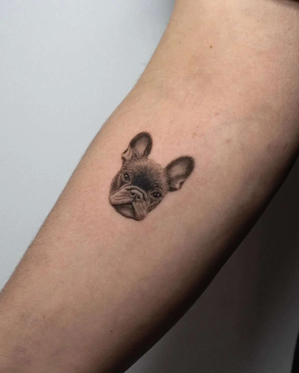 Coin-size realistic French Bulldog portrait tattoo, approx. 4 cm, Zürich